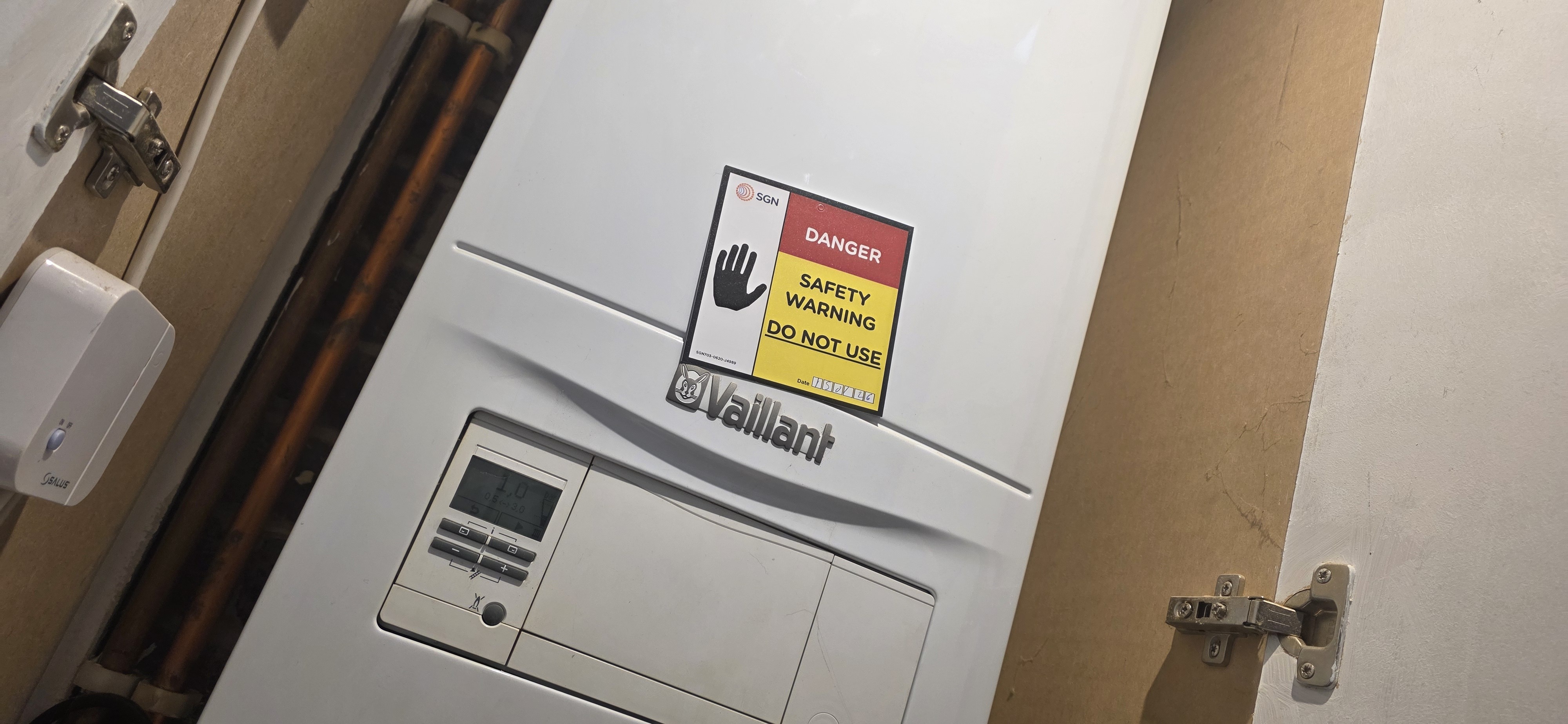 Boiler warning label indicating the appliance is unsafe to use